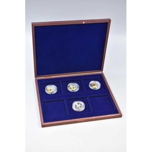 156 - Four Elizabeth II Tristan Da Cunha Coronation Anniversary Crowns complete with Case