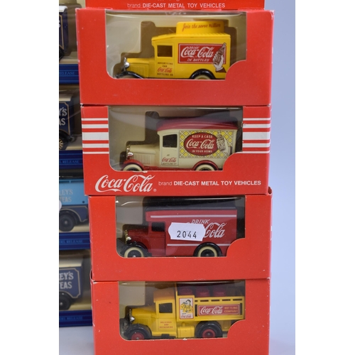 619 - Four Coca-cola diecast model trucks & 4 Tetly's Tea diecast trucks