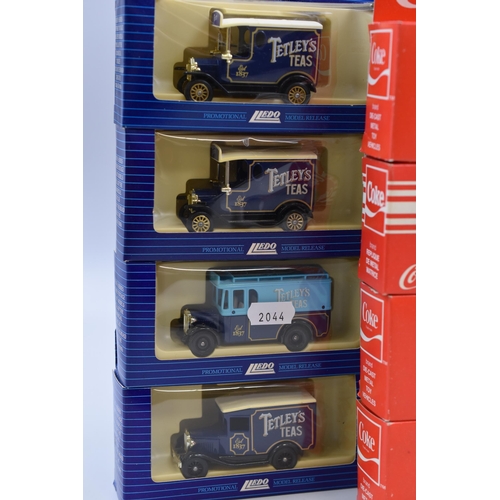 619 - Four Coca-cola diecast model trucks & 4 Tetly's Tea diecast trucks