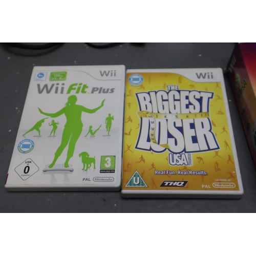 623 - Black Nintendo Wii with a Wii fit board, Wii fit plus, The biggest loser and Zumba