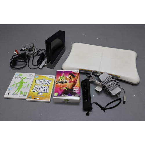 623 - Black Nintendo Wii with a Wii fit board, Wii fit plus, The biggest loser and Zumba