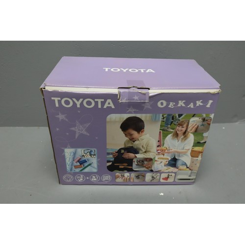 549 - Boxed Toyota Oekaki Sewing Machine complete with power lead and accessories