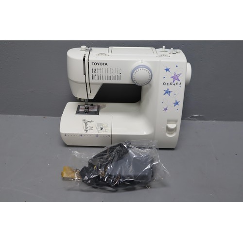 549 - Boxed Toyota Oekaki Sewing Machine complete with power lead and accessories