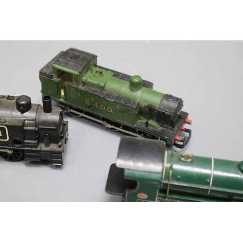 554 - Selection of 4 model train engines and trucks with some other items