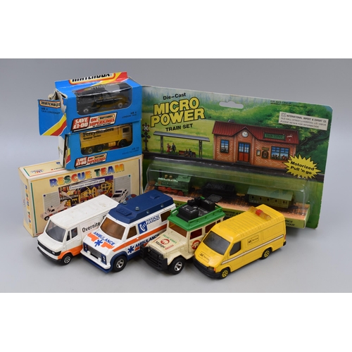 563 - Collection of model die-cast cars including Matchbox and Corgi vans plus a rescue team die-cast set ... 