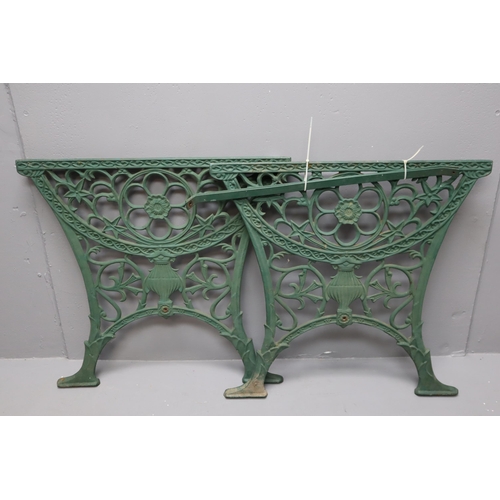 716 - Two cast iron table ends