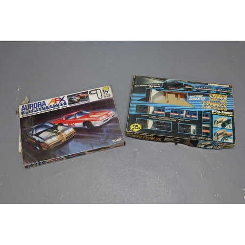 846 - Two Vintage Boxed Track Games to include a Tomy Aurora AFX Midnight Racers Track seems to be complet... 