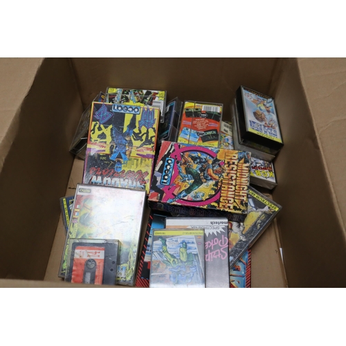 863 - A large lot full of vintage Cassette games to include: Ghostbusters, Rainbow Island,Traget; Renegade... 