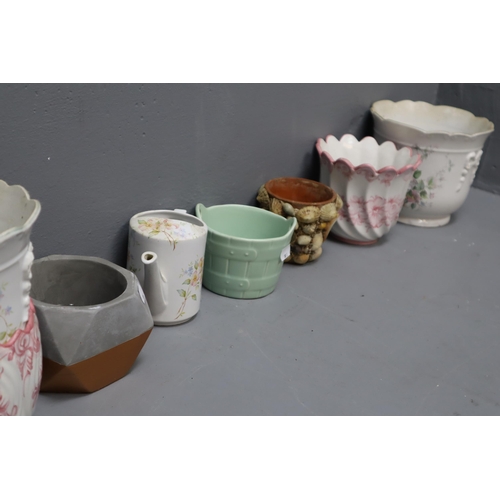 857 - A Selection of Nine Planters And a Ceramic Watering Can To Include Set of Three Graduating Floral Pl... 