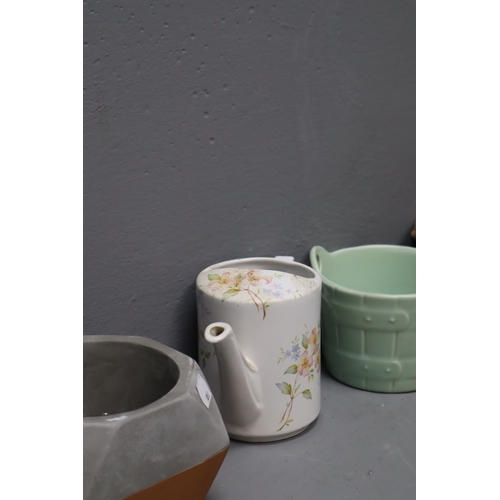 857 - A Selection of Nine Planters And a Ceramic Watering Can To Include Set of Three Graduating Floral Pl... 