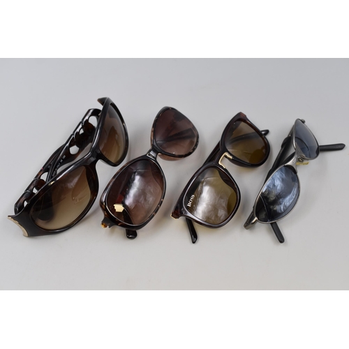 206 - Four pairs of vintage designer themed glasses to include Boss, Oakley, and more