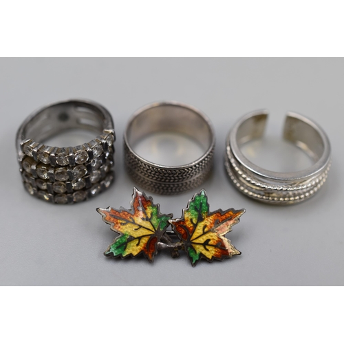 38 - Three Silver 925 Rings and a Canadian Maple Leaf Broach