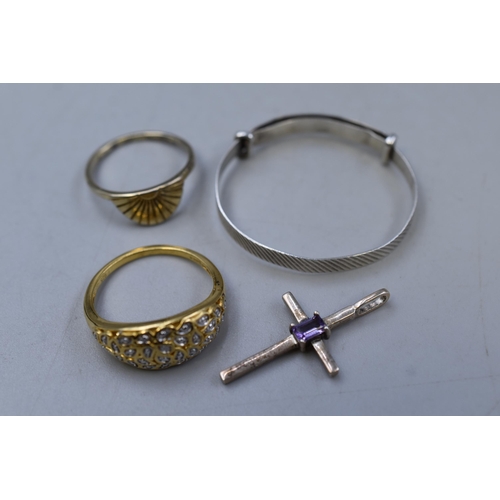 221 - Selection of Silver including three Rings, Cross Pendant and a Childs Adjustable Bracelet