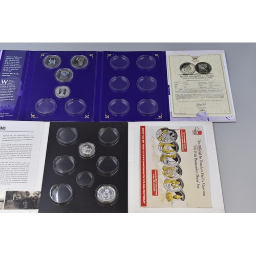 143 - Two coin sets to include: The Official In Flanders Fields Museum We Will Remember Them Set and Queen... 