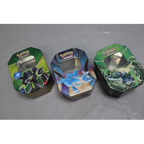 824 - A Selection of Twenty Five Pokemon TCG Tins (Empty), Two Pokemon TCG Boxes (Empty), And Pokemon Go D... 