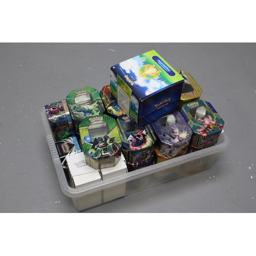 824 - A Selection of Twenty Five Pokemon TCG Tins (Empty), Two Pokemon TCG Boxes (Empty), And Pokemon Go D... 