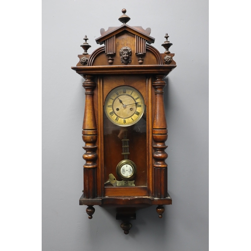 647 - Vintage pendulum wall clock in dark wood 33