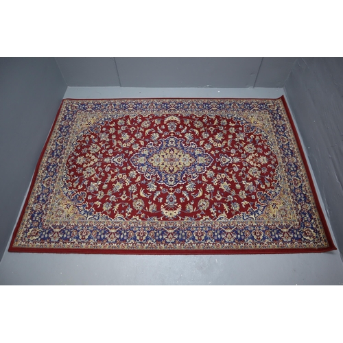 690 - A Vintage Floral Style Rug 77