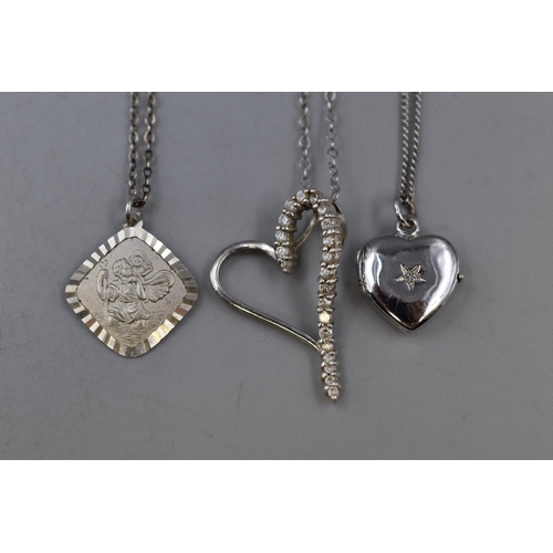 57 - Silver 925 3 necklaces to include Saint Christopher pendant, Heart locket pendant and A heart shaped... 