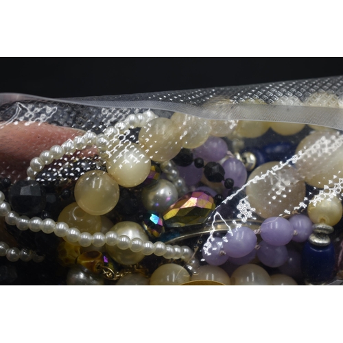 88 - A sealed bag full of unsorted jewellery