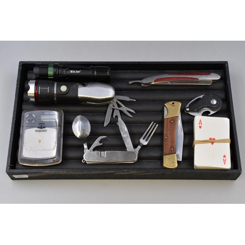 126 - A tray to include: playing cards, a cutthroat razor, two torches and more