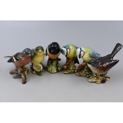 329 - Six Beswick Bird Figures including Greenfinch, Blue Tit, Stonechat, and More