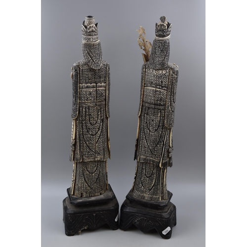 350 - Pair of Oriental Figures standing on Wooden Plinths (23