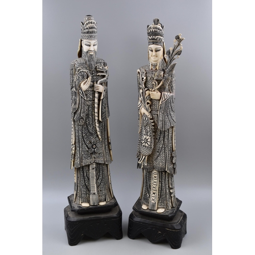 350 - Pair of Oriental Figures standing on Wooden Plinths (23