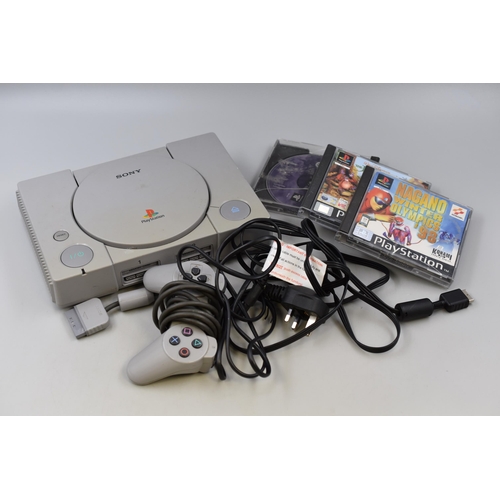 588 - A Sony Playstation Console With One Controller and Three Games (Harry Potter and The Philosopher's S... 