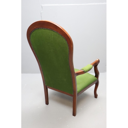 627 - Victorian dark wooden spoon back arm chair with dark green buttoned upholstery (44