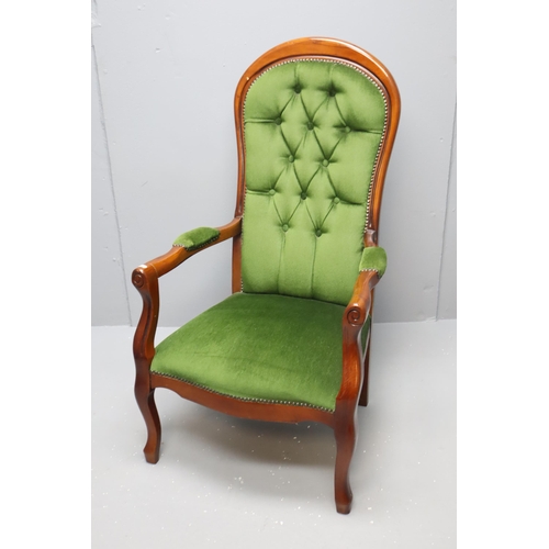 627 - Victorian dark wooden spoon back arm chair with dark green buttoned upholstery (44