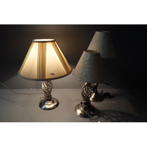 610 - 3 lamps, one tall lamp with beige shade and two (1 small & 1 big) lamps beige with a twist style... 