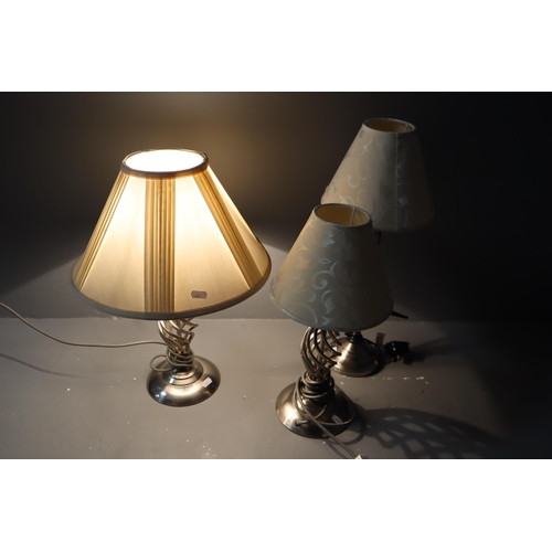 610 - 3 lamps, one tall lamp with beige shade and two (1 small & 1 big) lamps beige with a twist style... 