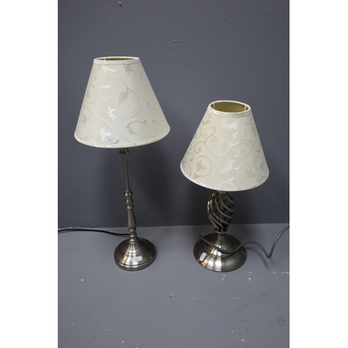 610 - 3 lamps, one tall lamp with beige shade and two (1 small & 1 big) lamps beige with a twist style... 