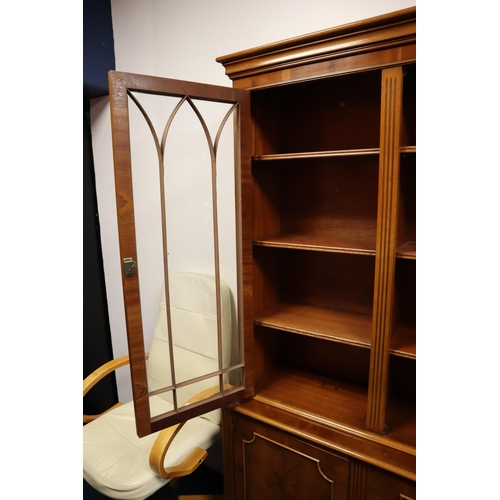 690 - Vintage teak display cabinet with two glass filled doors comprising of 9 shelves on the top and a bo... 