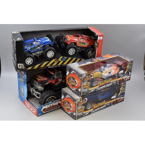 468 - Collection of Four Boxed Friction Power Vehicles To Include Monster Trucks and Two Racing Cars, Comp... 