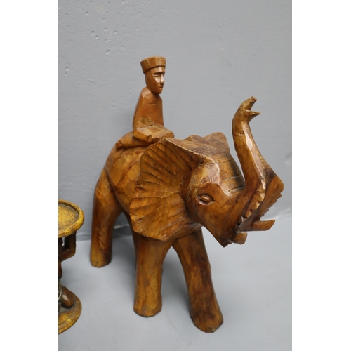 888 - A Selection of Wooden Items To Include Pair of Tribal Candleholders, Hand Carved Elephant, Tribal Fi... 