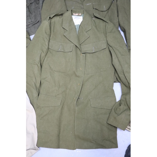 897 - Authentic British Army surplus to include, shirts, hats/caps, jackets & a water caddy (8 jackets... 