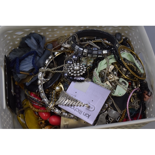 503 - A basket full of unsorted jewellery