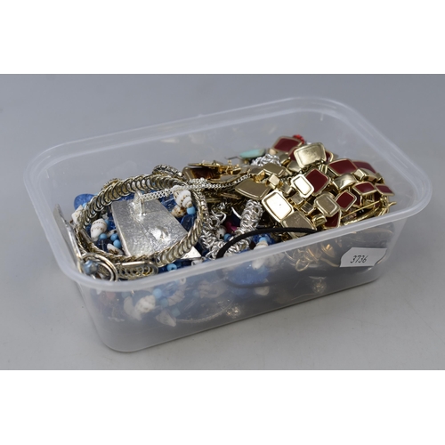 111 - A box full of unsorted jewellery