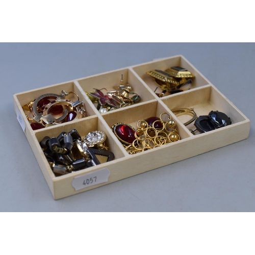 280 - A selection of earrings to include: Ruby styled clip on earrings and more