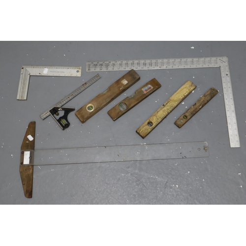 723 - A Selection of Tools To Include Four Spirit Levels, Two Set Squares, And Other