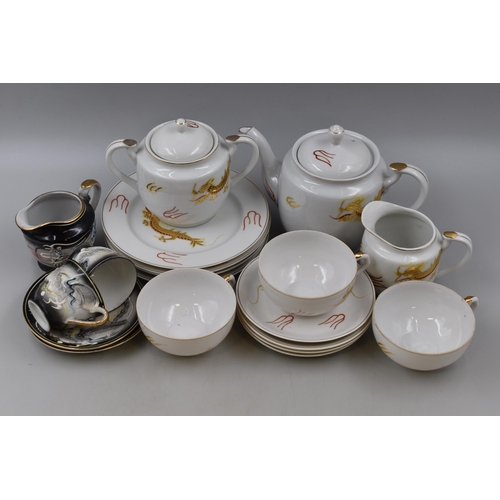 802 - Two Part Japanese Geisha Girl Tea Sets. Inlcudes Gold and White (Fourteen Pieces), And Black and Whi... 