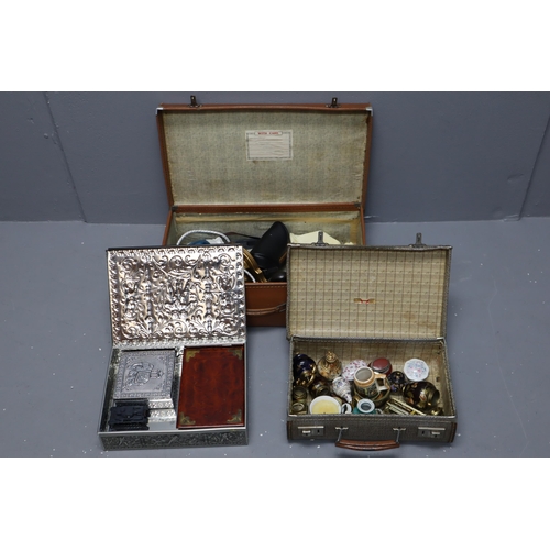 790 - A Large Selection of Collectables (In Two Cases and One Tin). To Include Dinky, Enamelled Brassware,... 