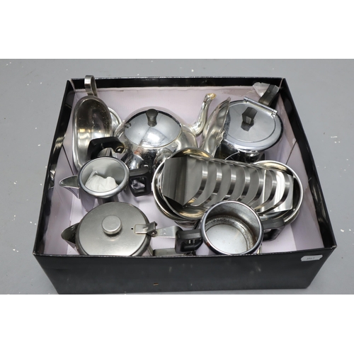 810 - Box full of stainless steel items to include tea pots, toast rack and more