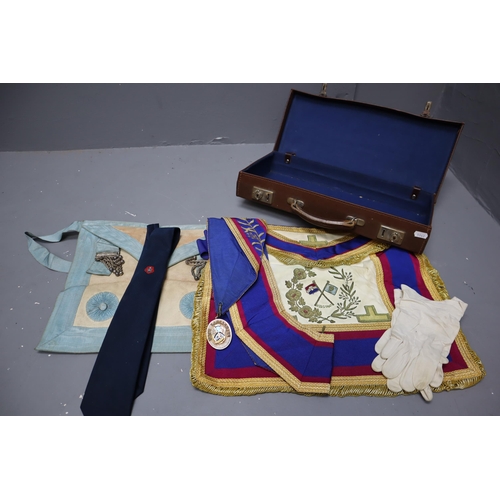 815 - Two Cases containing a selection of Masonic Regalia including Aprons, Sash's, Jewels, Paperwork and ... 