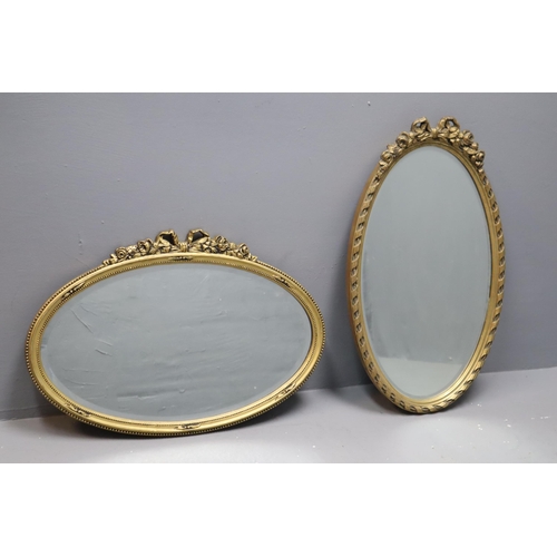 817 - Two vintage antique bevelled gilt oval wall hanging mirrors (landscape 21