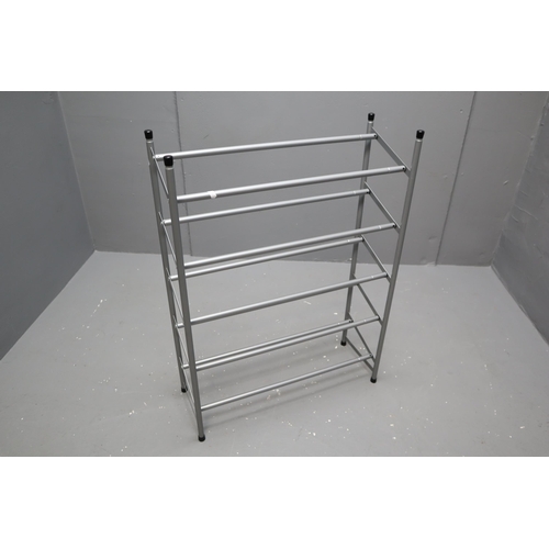 718 - An extendable metal, three shelf shoe rack. No Postage