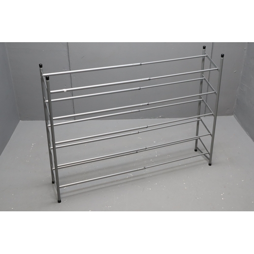 718 - An extendable metal, three shelf shoe rack. No Postage