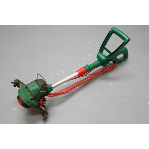 738 - QualCast Corded Strimmer (Powers On When Tested). No Postage